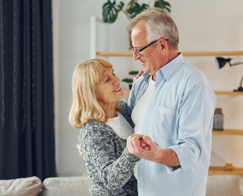 senior couple dancing in their home, TMS Therapy for Depression
