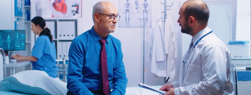 brain and body health, doctor talking to male patient