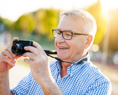 senior-man-smiling-outdoors_learning-photography-after-treating-adult-adhd