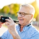 senior-man-smiling-outdoors_learning-photography-after-treating-adult-adhd